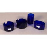 Four various blue glass condiment liners