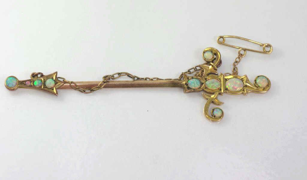Good antique 9ct gold sword brooch