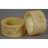 Two antique oriental carved ivory napkin rings