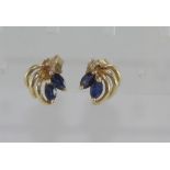 A pair of sapphire and diamond studs
