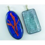 Two dichroic glass pendants by Nick Rhineheat