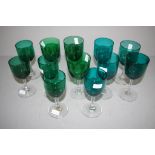 Twelve Victorian Bristol green wine glasses