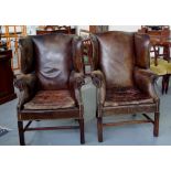 Pair of leather wingback armchairs