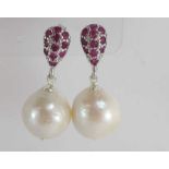 A pair of silver, pearl and ruby drop earrings