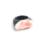 A rose coral and black resin ring