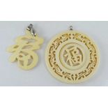 Two Oriental carved ivory pendants