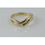 A two tone gold and diamond ring