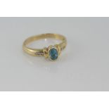 9ct yellow gold, blue topaz and diamond ring