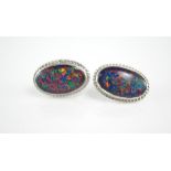 A pair of large white gold and opal earrings