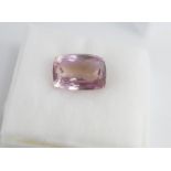 An unset cushion cut ametrine