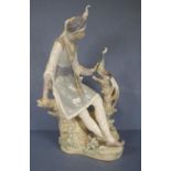 Large Lladro Arab boy figurine seated on a branch