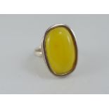 A silver and amber ring