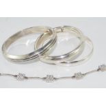 Four various silver bangles