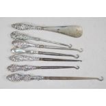 Six various Edwardian silver handle button hooks