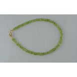 A facetted peridot bead bracelet