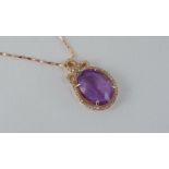 A gilt silver and amethyst pendant