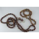 Two bronze coloured pearl necklaces