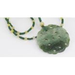 Carved greenstone pendant