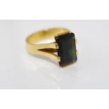 An 18ct yellow gold and dark green stone ring