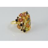 A silver gilt and multi-coloured sapphire ring
