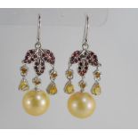 A pair of golden pearl, ruby and sapphire earrings