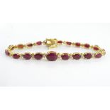 Yellow gold, ruby and diamond tennis bracelet