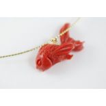 A red coral fish pendant