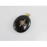 A Victorian onyx, gold and seed pearl open locket