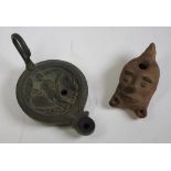 Two archaic oil lamps