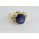 A gold, natural sapphire and diamond dress ring