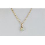 Solid opal and gold pendant on gold chain