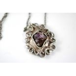 A vintage Danish silver pendant set with amethyst