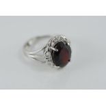 Silver and garnet ring