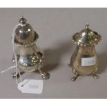 Two various George V sterling silver pepperettes