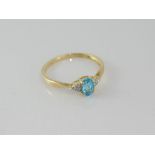 14ct yellow gold, blue topaz and diamond ring