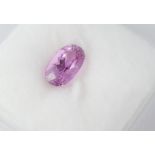 An unset dark pink oval kunzite