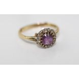 A gold, amethyst and diamond daisy ring