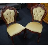 Two carved dining chairs