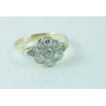 Yellow gold and diamond daisy ring