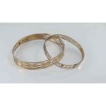 Two vintage silver lined gold arm bands