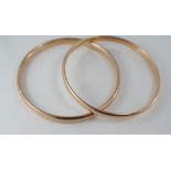Two vintage 9ct gold silver lined bangles