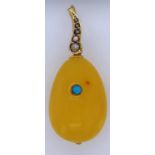 Butterscotch amber and 9ct gold pendant