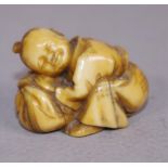 Antique Japanese ivory netsuke -Boy crouched down