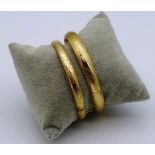 Two 14ct yellow gold bangles