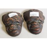 Pair Australian Aboriginal carved ceramic heads