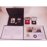 Four boxes of UK commemorative coins