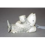 Antique Chinese ivory man with fish figurine