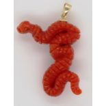 Carved coral snake and 9ct gold pendant