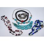 A collection of semi precious stone bead necklaces