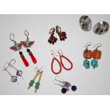 Nine various pairs of earrings